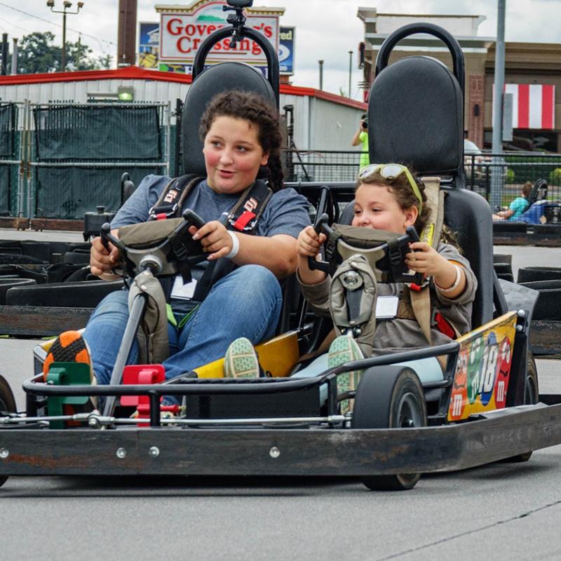 Riding a double go kart