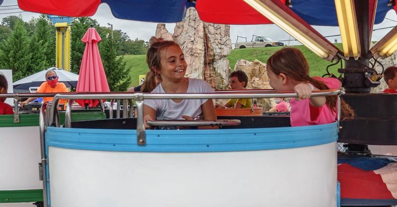 two girls on sparkie spinners ride