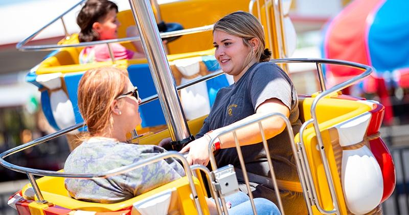 two women on speedway spotters ride